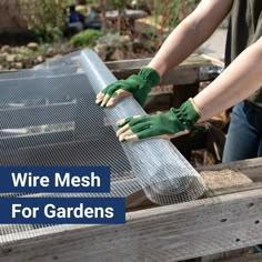 a person wearing green gloves and gardening gloves on top of a metal grate with the words wire mesh for gardens