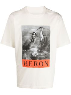 a white t - shirt with herons on it