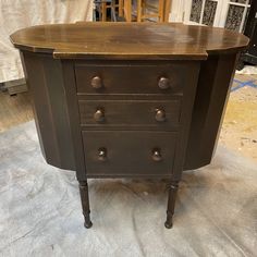 an old dresser is sitting on the floor