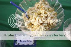 there is a bowl of popcorn on the table with other food items around it and a sign that says protect more of your memories for less