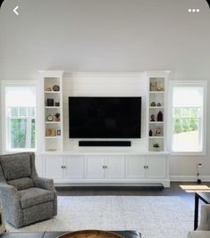 a living room filled with furniture and a flat screen tv mounted on a wall above a fireplace