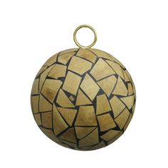 an ornament made out of wood with black and white designs on it's surface