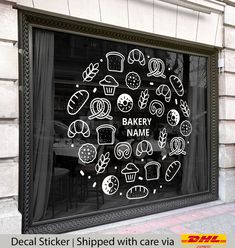 a bakery shop window with stickers on it's glass that says, decal sticker shipped with care via