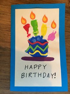 a birthday card that says happy birthday with candles in the shape of a cupcake