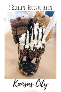 an ice cream sundae with cookies and oreo cookies on top, in a mason jar