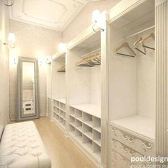 an empty walk in closet with white walls and shelving units on the wall, along with a bench