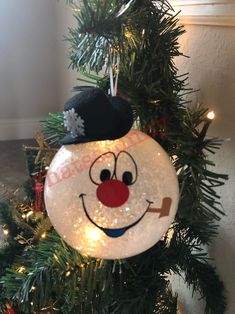 a christmas ornament hanging from the top of a tree