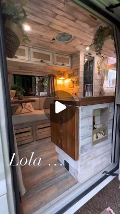 the inside of a camper that is being used as a kitchen and living area