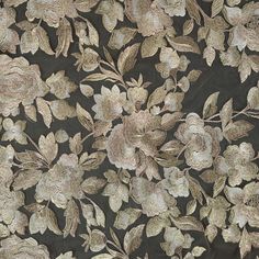 a black and gold floral design on fabric