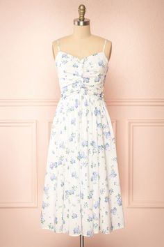 Sayonelle Short White A-line Dress w/ Blue Floral Motif | Boutique 1861 front view White A Line Dress, Boutique 1861, White Midi, Ruched Bodice, Couples Poses For Pictures, White Midi Dress, Couple Posing, Ruffle Trim, Floral Motif