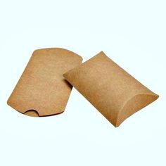 two pieces of brown paper sitting on top of each other