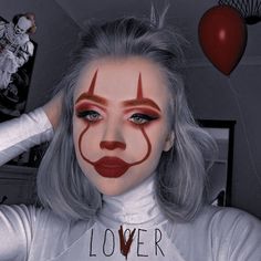 a woman with grey hair and clown makeup