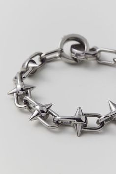 Linked chain bracelet by Personal Fears with shrapnel spike accents and fitted with a secure clasp closure.Features. Chain bracelet from Personal Fears Linked chain with spike accents Clasp closure Content + Care. Wipe clean Imported Adjustable Metal Jewelry With Spikes, Adjustable Spiked Metal Jewelry, Edgy Metal Bracelets With Spikes, Edgy Metal Spike Bracelets, Edgy Spiked Metal Bracelets, Adjustable Metal Bracelets With Spikes, Adjustable Silver Bracelet With Spikes, Silver Metal Bracelet With Custom Hardware, Silver Punk Bracelets With Spikes