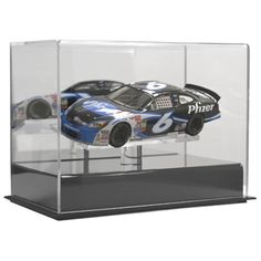 a model car in a glass case with the number six on it's side