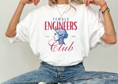 Women's Engineer T Shirt Proud Female Engineer Tee Gift for Women in STEM Engineering Graphic Shirt for Women Perfect for Women Engineers T CUSTOM DESIGN REQUESTS ARE WELCOME! MESSAGE ME 😊 𝑯𝑶𝑾 𝑻𝑶 𝑶𝑹𝑫𝑬𝑹 ✅ Choose color option ✅ Read size chart and select size ✅ Add to cart ✅ Check out and purchase item ✅ Shipping info provided via Etsy 𝑰𝑻𝑬𝑴 𝑰𝑵𝑭𝑶 😊 Comfort Colors 1717 T-Shirts 😊 Unisex Adult Sizing  😊 Direct to garment printing 😊 See listing for colors 😊 See listing for size chart  𝐘𝐨𝐮 𝐦𝐚𝐲 𝐚𝐥𝐬𝐨 𝐥𝐨𝐯𝐞... Custom Medal Holder https://www.etsy.com/listing/1657749048/personalized-medal-hanger-triathlon?click_key=5e0d038c27b408be6fcad0d0a1672b90d2e64812%3A1657749048&click_sum=62f35ded&ref=shop_home_feat_1 Customizable Transistion Towel! https://www.etsy.com/list Female Engineer, Stem Engineering, Women In Stem, Engineer Shirt, Tshirt Painting, Shirt For Women, Graphic Shirt, Etsy Items, Triathlon