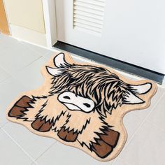 a door mat with an image of a yak on it in front of a door