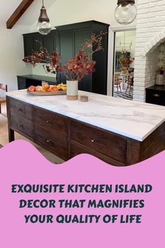 a kitchen island with marble counter tops and pink accents