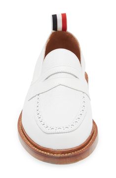 A tricolor grosgrain pull loop brings the label's signature flair to this calfskin-leather loafer detailed with classic broguing at the apron toe. Leather upper and lining/leather and synthetic sole Made in the UK Designer Shoes White Slip-on Tassel Loafers For Business, Workwear Wingtip Moccasins With Brogue Detailing, Wingtip Tassel Loafers With Stitched Sole For Work, White Loafers With Leather Sole And Plain Toe, White Loafers With Leather Sole And Moc Toe, Classic White Wingtip Moccasins, White Leather Sole Moc Toe Loafers, White Leather Sole Moccasins For Business, White Leather Tassel Loafers For Business