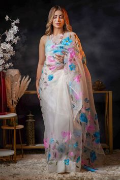 Semi-stitched White Saree With Floral Print, Designer White Saree With Floral Embroidery, White Pre-draped Saree With Floral Embroidery For Festivals, Traditional White Pre-draped Saree With Floral Print, Designer White Organza Saree, Bollywood White Saree With Floral Print, White Floral Print Organza Dupatta, Traditional White Saree With Floral Print, Floral Print Saree For Wedding