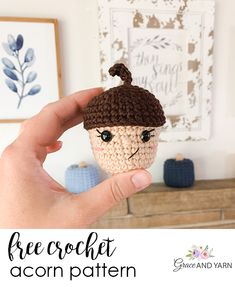 a hand holding up a small crocheted doll