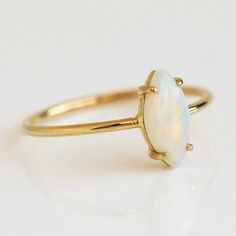 Dainty minimalist opal ring, prong setting, 18k gold plated over sterling silver. Everyday 14k Gold Opal Ring, Adjustable Gold Opal Ring Fine Jewelry, Everyday 14k Yellow Gold Opal Ring, Fine Jewelry Gold Opal Birthstone Ring, Gold 14k Opal Ring As Gift, Dainty Yellow Gold Opal Jewelry, 14k Gold Opal Ring For Gift, Gold Opal Ring With Birthstone, Gold Dainty Opal Ring Birthstone