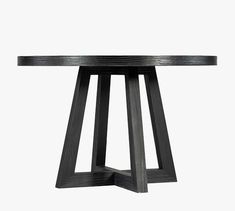 a black table with two wooden legs and a circular top, on a white background