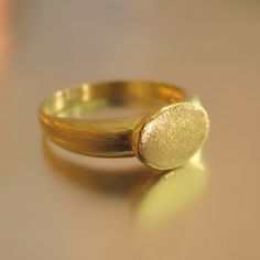 The Ring Made From 14 Karats Yellow Gold. Width Of The Signet: 0.35x0.43inch/ 9x11mm. Ring Width In The Wide Section: 0.15inch/ 4mm. In Figures 7 And 10 You Can See A Different Example Of A Signet Ring, Also In A White Gold. Signet Ring For Men. Signet Ring For Women. Unique And Special 14-Carat Gold Signet Ring. This Classy And Beautiful Ring Band Will Always Look Great. Delicate Signet Ring With A Flat Head A Classy And Unique Presence. Available In All Sizes, Color Gold, And Karat. Elegant Gold Dome Ring Stamped 14k, Antique Signet Ring, Classic Gold Engraved Ring In Recycled Gold, Gold Signet Ring In Recycled Gold For Formal Occasions, Classic Gold Engraved Ring In Recycled Material, Formal Gold Signet Ring In Recycled Gold, Classic Engraved Gold Ring In Recycled Gold, Classic Engraved Gold Ring With Recycled Gold, Gold Oval Engraved Ring With Polished Finish