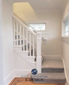 an empty room with stairs and carpeted flooring