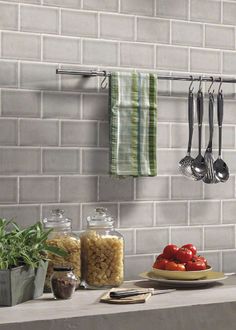 a kitchen counter topped with lots of cooking utensils