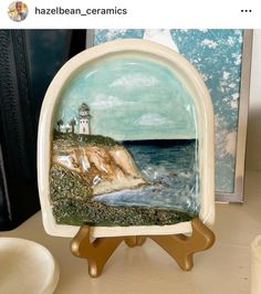 an image of a plate with a lighthouse on it