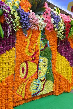 an arrangement of flowers are arranged on display