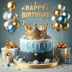 a birthday cake with gold and blue decorations on it, surrounded by balloons and presents