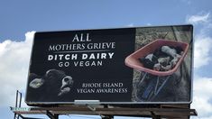 a billboard with an image of cows in a wheelbarrow and the words, all mothers give ditch dairy go vegan