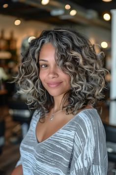 Gray Blending Highlights And Lowlights, Blending Gray Hair Black Women, Grey Blending Black Women, Gray Hair With Brown Highlights, Grey Hair Color Curly, Growing Out Gray Hair Blending Curly, Gray Blending Curly Hair, Curly Hair With Grey Highlights, Dark Curly Hair With Money Piece