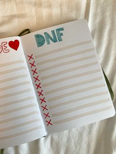 an open planner book with the words do something on it and a red heart in the middle