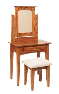 a wooden dressing table and stool with mirror on it's top, against a white background