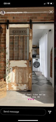 an old door is open to reveal the laundry