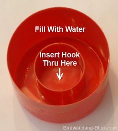 three red bowls with the words fill with water and insert hook thru here