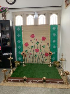 a room decorated with flowers and candles