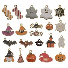 a collection of halloween charms in various shapes and sizes, all with different designs on them