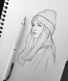 a pencil drawing of a girl wearing a beanie and holding a pen in her hand