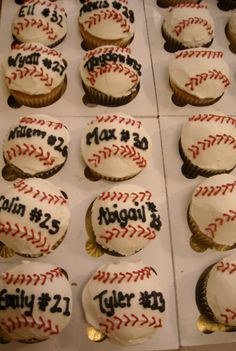 cupcakes decorated with white frosting and baseball designs