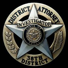 a police badge with the words district attorney in it's center and an eagle on top