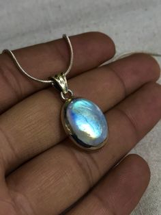 Rainbow Moonstone Pendant Amazing Blue Strong Flash Fire Gems Stone Made with 92.5 Sterling Stone Size - 11x15 mm Pendant length - 2.5 Cm Long ( IMPORTANT NOTICE ) U WILL RECEIVE SAME THING IN THE PICTURE 100 %guaranteed IF NOT U WILL GET FULL REFUND ) If you have any questions, do not hesitate feel free to contact us! We would love to hear from you. If you need more than this, please let us know, we will create a special offer listing for you. if you like to see our more beautifull, gorgeous be Silver Celestial Jewelry With Oval Cabochon, Blue Moonstone Round Jewelry, Blue Round Moonstone Jewelry, Blue Moonstone Jewelry With Stones, Oval Blue Moonstone Necklace, Blue Cabochon Moonstone Jewelry, Cut Photo, Rainbow Moonstone Pendant, Tears Of Joy