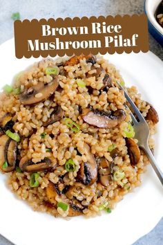 brown rice with mushrooms and green onions on a white plate