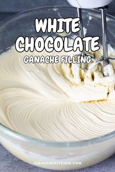 white chocolate is being made in a glass bowl with a whisk on top