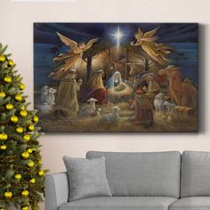 a christmas nativity scene with angels and baby jesus in the manger, surrounded by sheep