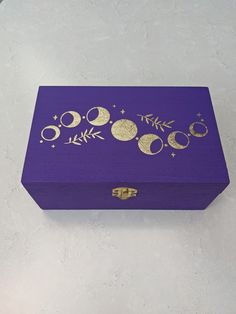 a purple box with gold designs on it