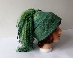 Felted hat, Green wool hat, Felt winter warm hat, Curly free Wool Hat Unisex, Warm felt hat This felted hat was made of soft merino wool and wool locks  through a wet felting process.  Felt hat is decorated with , wool locks  You can make folds and wearing a hat on the different ways. Felted hat is warm and perfect for cold weather.   Head circumference 58-59 cm (22,5''-23'') Full height caps without locks  23 см (9.1 in) The scarf for the set https://www.etsy.com/listing/739219323/felt-fur-curly-scarf-rustic-green-hand Easy care. Hand wash in soap water. Rinse, let it dry. Steam iron. Thanks, for visiting my shop Ready to ship Felted Hat, Hat Wool, Green Hand, Wool Winter, Wearing A Hat, Steam Iron, Green Wool, Wet Felting, Felt Hat