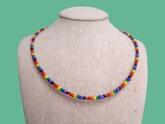 this discrete inclusive pride flag seed bead necklace is the cutest accessory for celebrating your pride and allegiance! this necklace is absolutely perfect for those who are out-and-proud and for those who are still in the closet! <3 **packaging is completely discreet * the item(s) you receive will always be slightly different from the picture since every item is custom, unique, and handmade to order. please allow for small variations in each product * necklace length: 14in + 2in chain extender Handmade Rainbow Necklaces For Everyday Wear, Handmade Rainbow Necklaces For Everyday, Adjustable Jewelry For Pride Festival Gift, Handmade Rainbow Necklace For Everyday, Rainbow Necklaces With Tiny Beads For Festivals, Rainbow Tiny Beads Necklace For Festivals, Adjustable Rainbow Necklaces With Spacer Beads, Rainbow Letter Beads Necklace For Festivals, Handmade Jewelry For Pride Gift